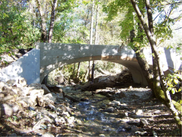 View of the finished prefabricated concrete bridge over Connor Creek