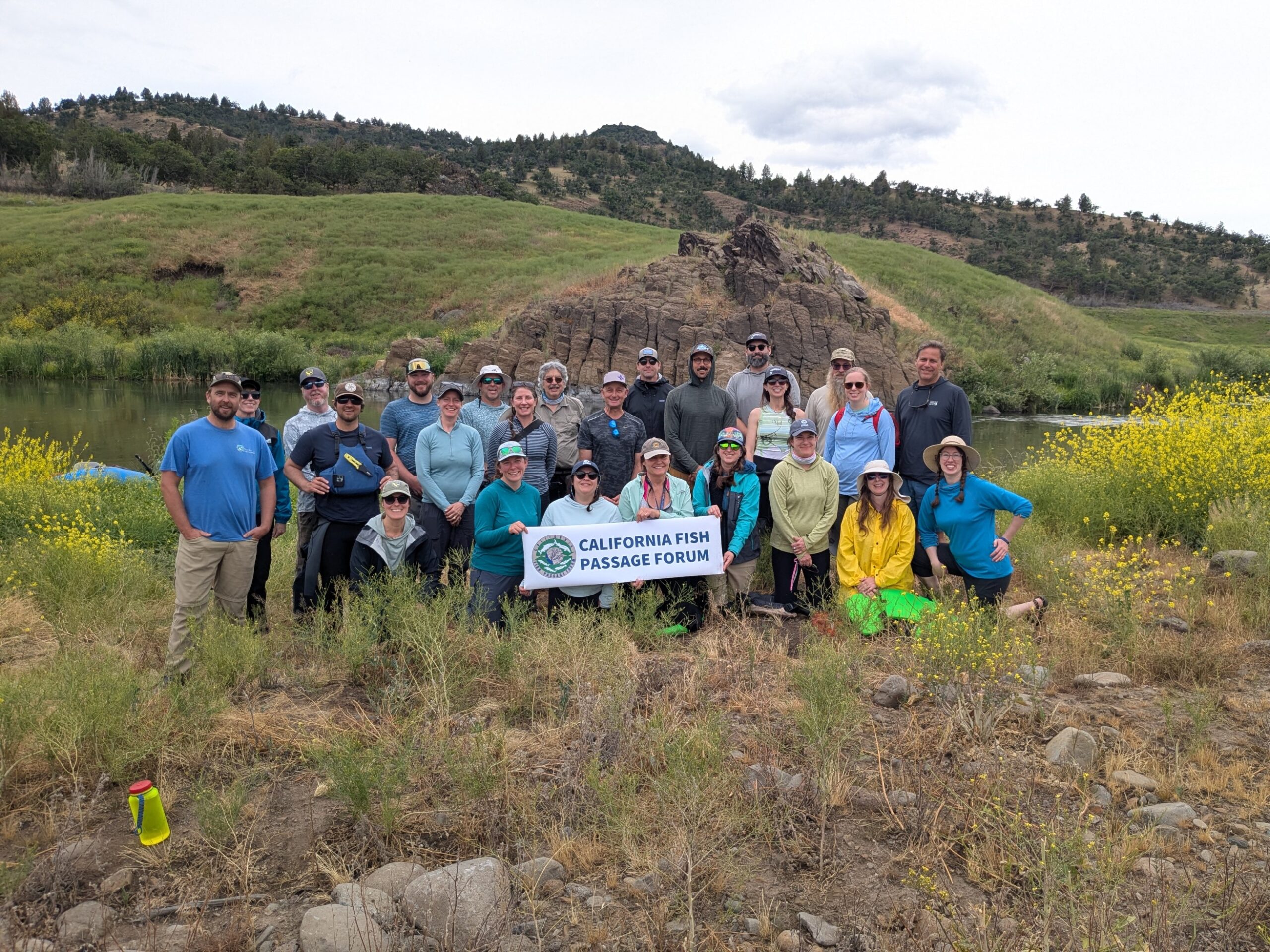 The California Fish Passage Forum members pose for a group photo beside the Klamath River.